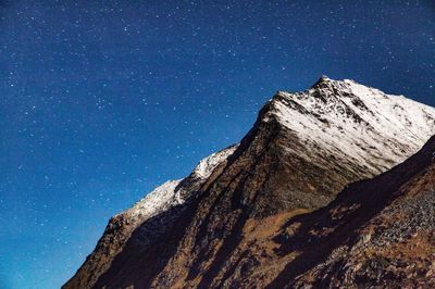 Mountain against star field