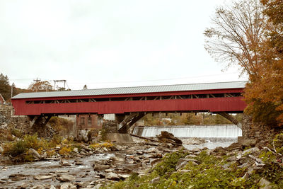 Bridge over river against sky