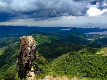 Scenic view of landscape against cloudy sky