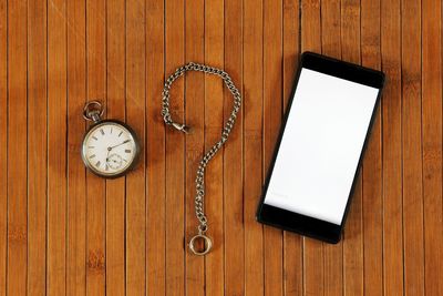 High angle view of clock on table