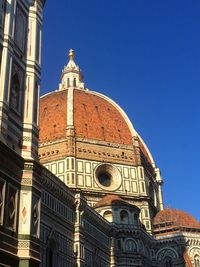 Low angle view of building against blue sky