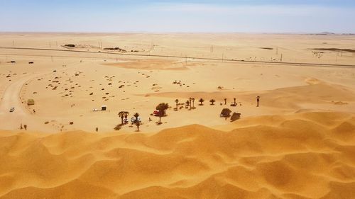 Group of people on sand dune