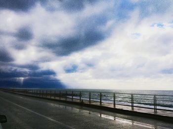 Scenic view of sea against cloudy sky