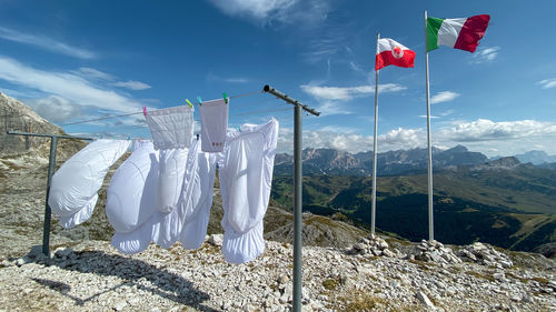 Clothes drying on clothesline against sky