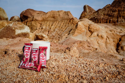 View of rock formations on landscape against sky