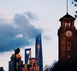 Low angle view of tower against cloudy sky