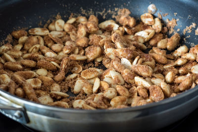 Close-up of sugared almonds in pan