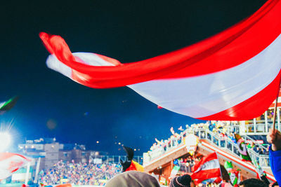 Midsection of people in traditional clothing against sky