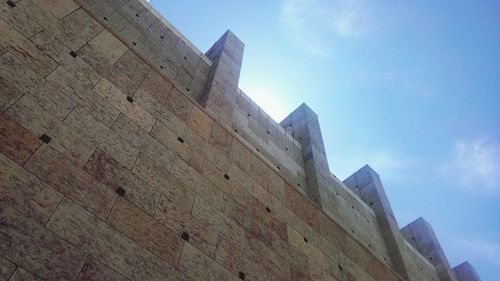 Low angle view of building against blue sky