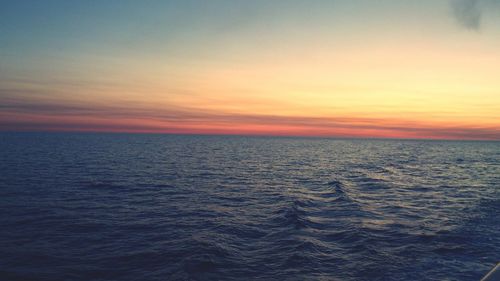 Scenic view of sea at sunset