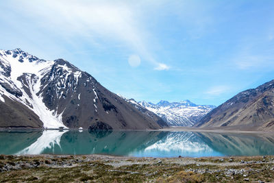 Scenic view of lake against cloudy sky