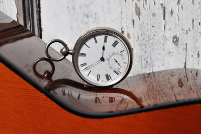 Close-up of clock on table