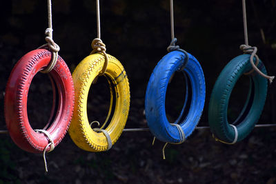 Close-up of multi colored umbrellas hanging on clothesline