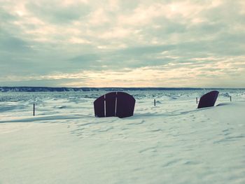 Scenic view of beach against sky during sunset