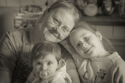 Portrait of cute girl with grandmother at home