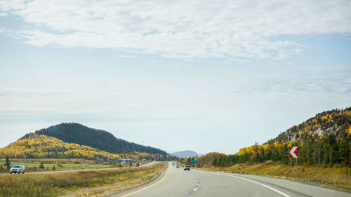 Road amidst landscape against sky