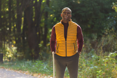 Rear view of man standing in forest