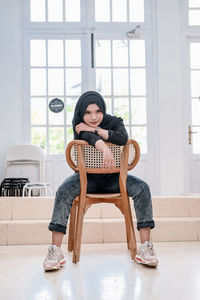 Portrait of cute girl playing with toys at home