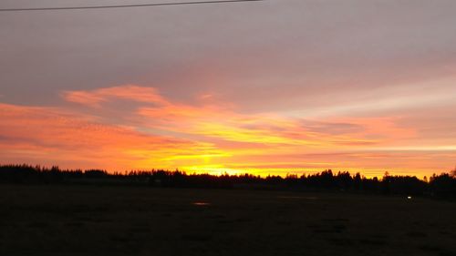 Scenic view of silhouette landscape against sky during sunset