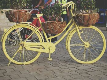 Close-up of bicycle against wall