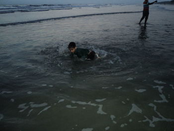 People swimming in sea