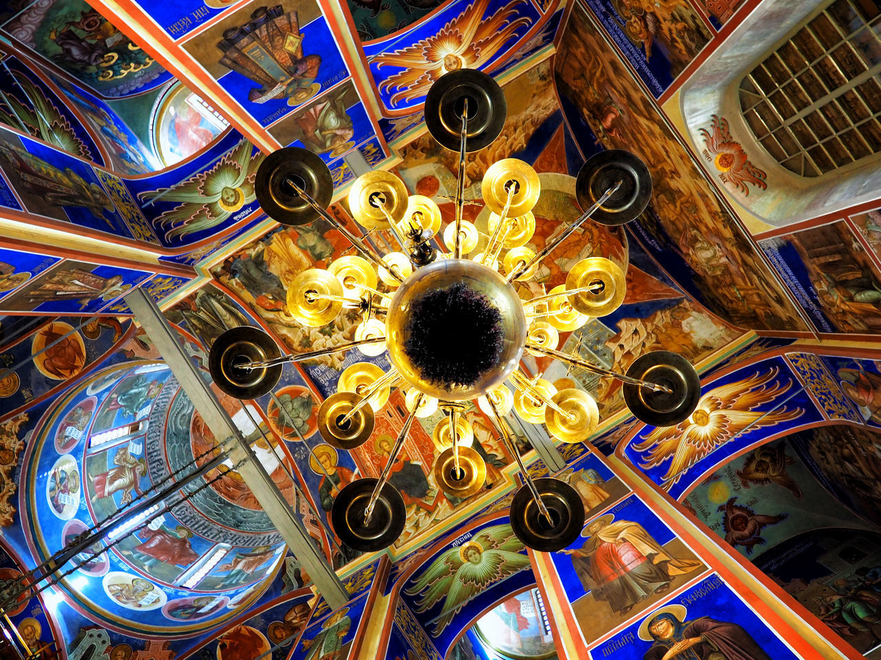 LOW ANGLE VIEW OF MULTI COLORED CEILING OF CATHEDRAL