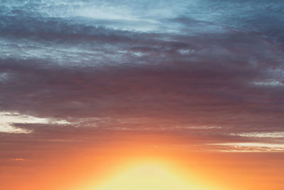 Low angle view of dramatic sky during sunset