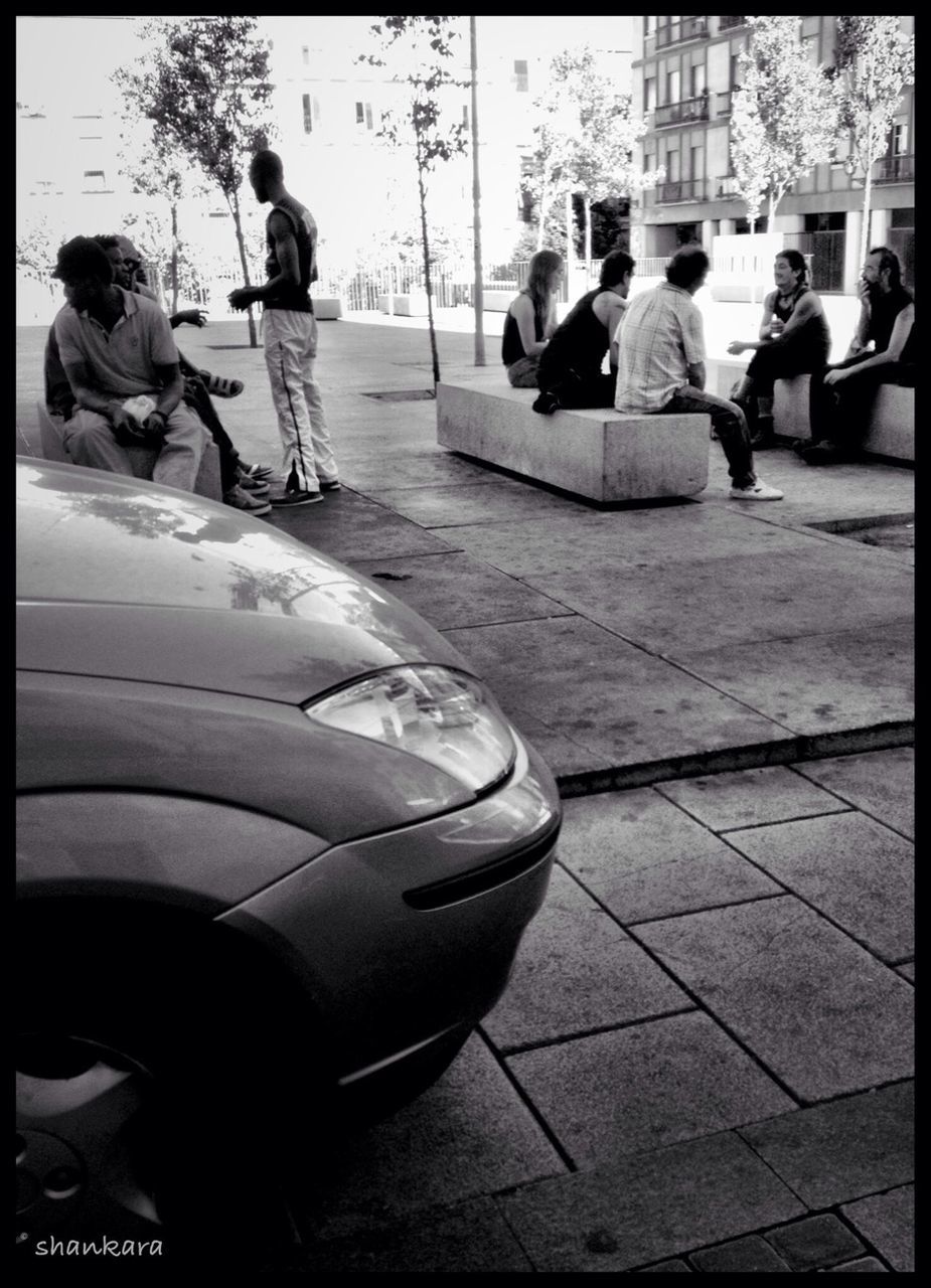 transfer print, men, lifestyles, auto post production filter, leisure activity, person, transportation, city life, mode of transport, full length, large group of people, street, city, rear view, walking, sitting, casual clothing, travel, day