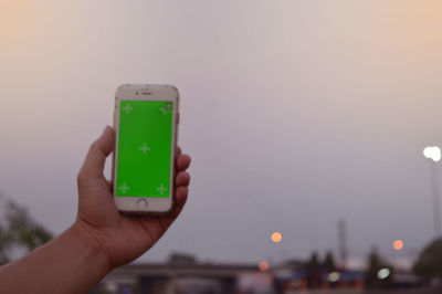 Close-up of hand holding mobile phone