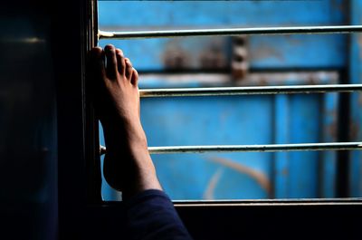 Low section of person at train window