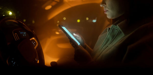 Midsection of woman using mobile phone