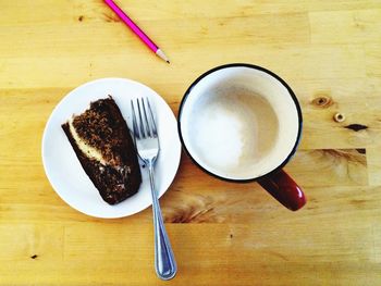 Directly above shot of coffee on wooden table