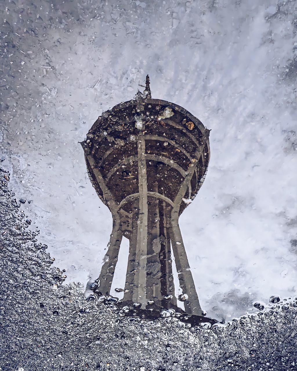 LOW ANGLE VIEW OF WATER TOWER DURING WINTER