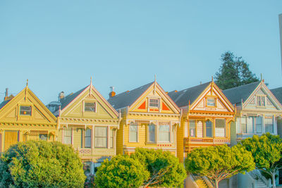 Low angle view of building against clear blue sky