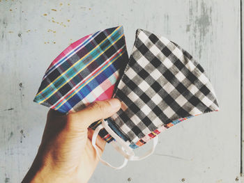 Close-up of hand holding umbrella