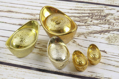 Close-up of ingot feng shui on table