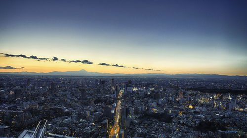 Aerial view of city at sunset