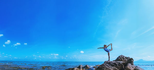 Scenic view of sea against blue sky