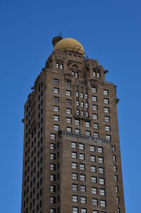Low angle view of building against blue sky