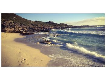 Scenic view of beach against clear sky