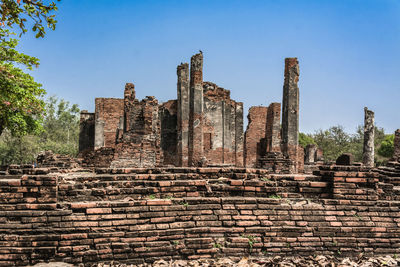 Low angle view of old ruins against clear sky