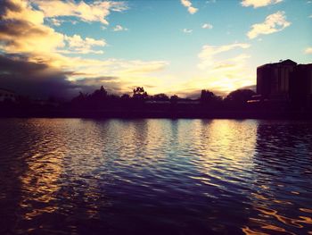 Scenic view of lake at sunset