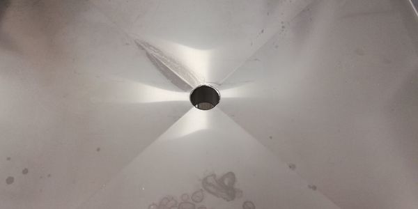 Low angle view of electric lamp on ceiling