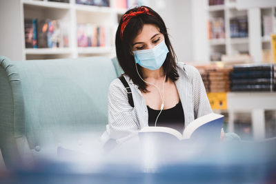 Young woman reading book