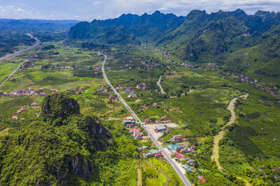 High angle view of road amidst trees and mountains