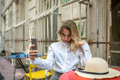 Young woman using mobile phone