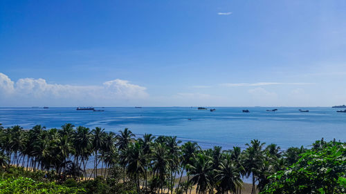 Tropical scenic view of blue sea against blue sky. 