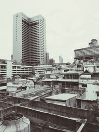 High angle view of buildings in city against sky