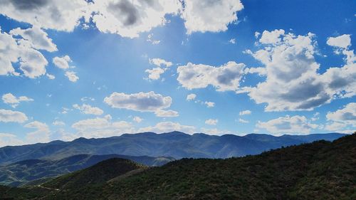 Scenic shot of clouds over mountain range