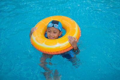 High angle view of boy swimming in pool